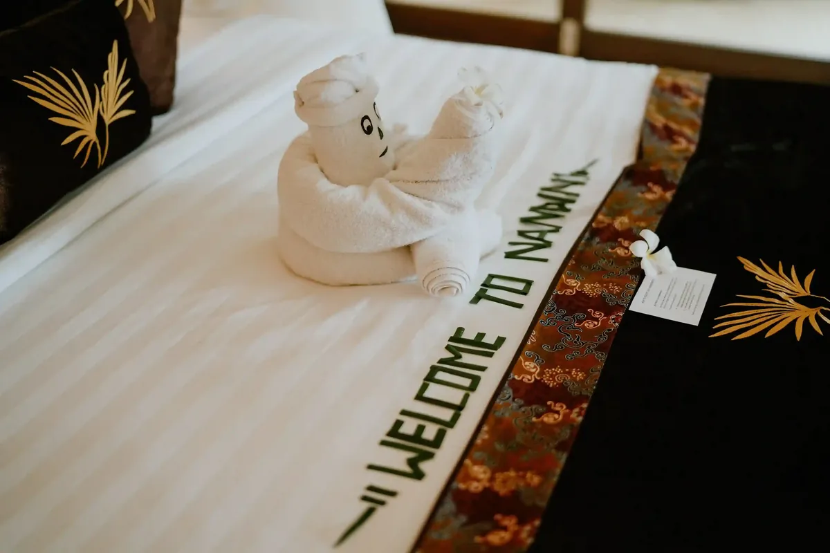 Welcome amenity laid out on the bed at Nandini, Ubud